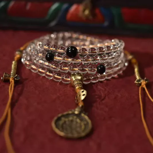企业微信截图_17446121598849 108-bead clear quartz mala with obsidian spacers and brass charm